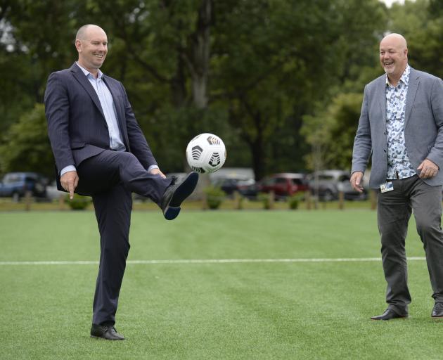 New Football South chief executive Dougal McGowan (left) and chairman Graham Marshall kick a ball...