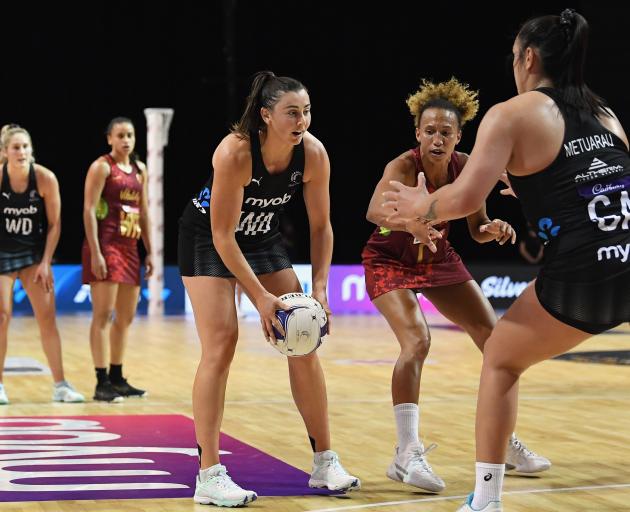 Silver Ferns wing attack Gina Crampton looks to feed Tiana Metuarau, while England’s Serena...