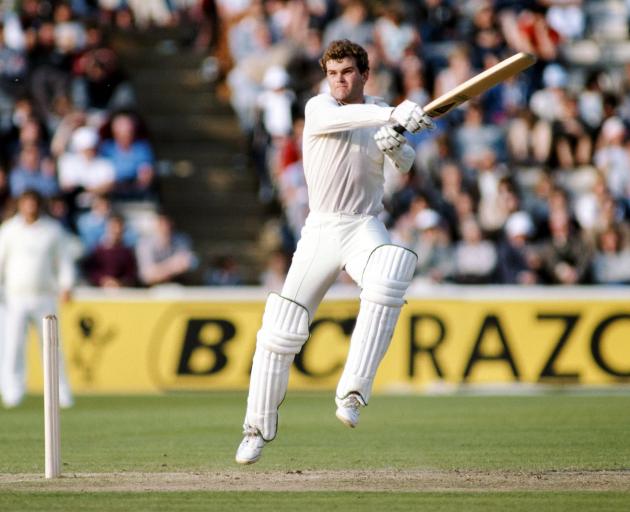 Martin Crowe goes airborne as he cuts a ball to the boundary during a test 
...