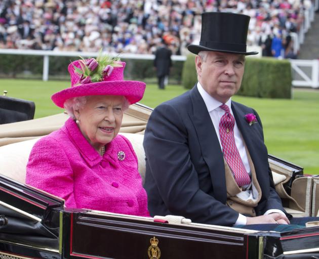 Prince Andrew was believed to be the Queen’s favourite child. Here they are attending Ladies Day...
