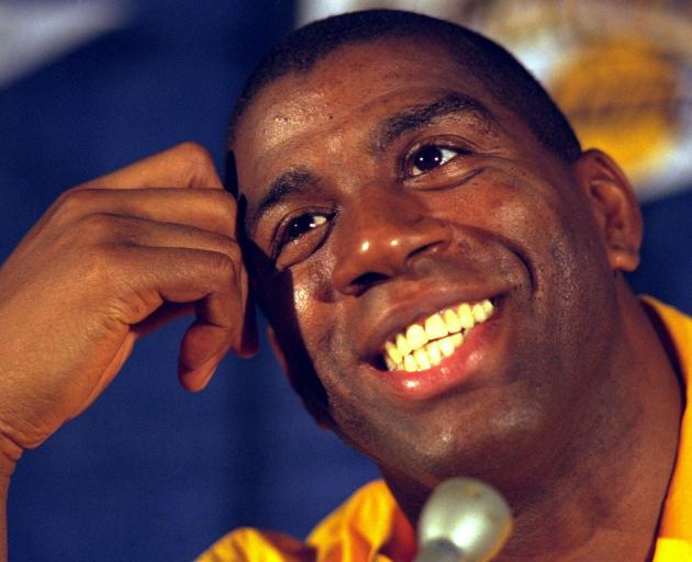 Magic Johnson talks to the media after making his comeback in 1996. PHOTO: GETTY IMAGES