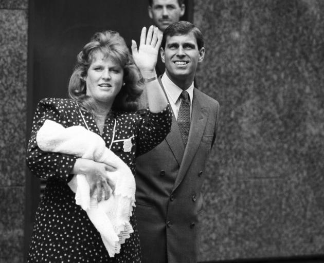 Prince Andrew, Duke of York, and Sarah Ferguson, Duchess of York, take their newborn daughter...