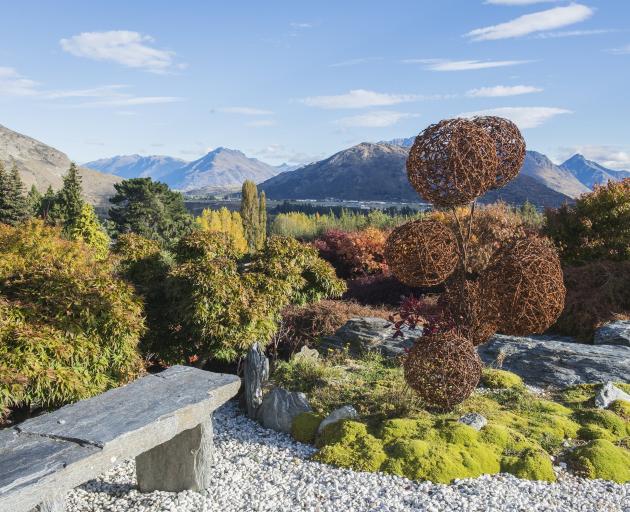 The Oriental Garden, which overlooks the Wakatipu Basin, features a cloud topiary in barbed wire...