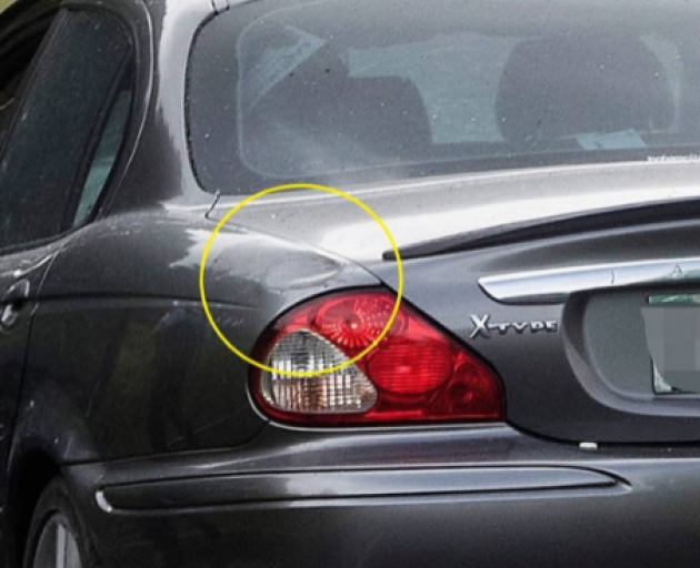 Anthea Hamlet's damaged Jaguar with the dent circled. Her lawyer's said it was evidence of a...