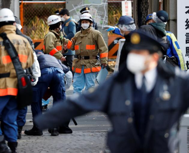 Emergency services at the scene on Saturday. Photo: Reuters 