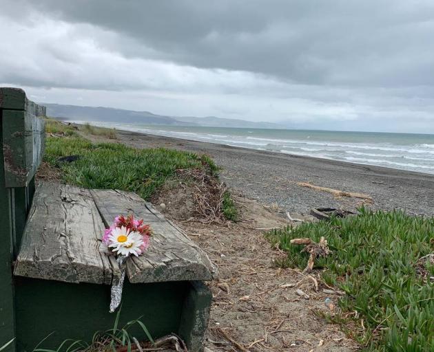 Flowers have been left at Leithfield Beach where human remains have been found. Photo: Kurt Bayer...