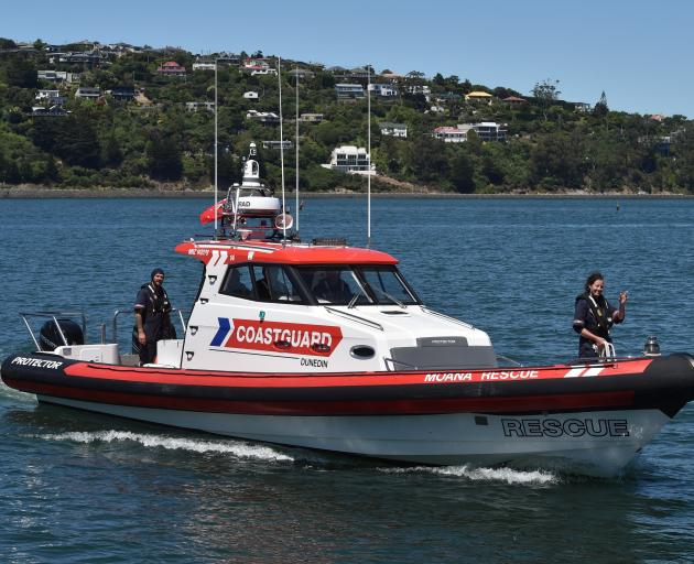 Rachel Johnstone, of Dunedin, waves from the bow of the Coastguard Dunedin's new vessel Moana...