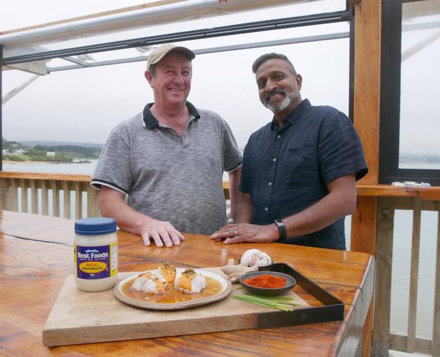 The FishWife co-owner John Pile, of Moeraki, and TV chef Ganesh Raj enjoy a meal. PHOTO: RUBY...