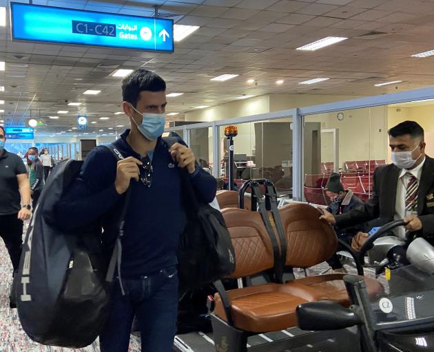 An unvaccinated Novak Djokovic at Dubai Airport on Monday after a federal court upheld the...