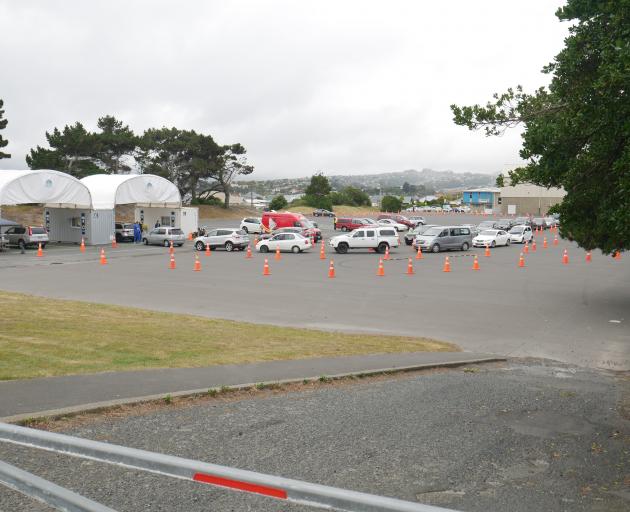 Motorists line up at Te Kaika’s Covid-19 drive-through vaccination and testing centre in Victoria...