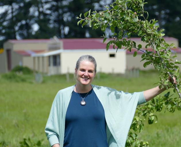 Project Bruce community development worker Kim Schiller inspects a fruit tree in the Bruce ...