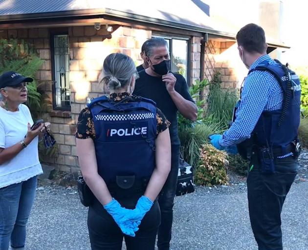 The moment Brian Tamaki was arrested at his home this morning for breaching bail. Photo: Supplied