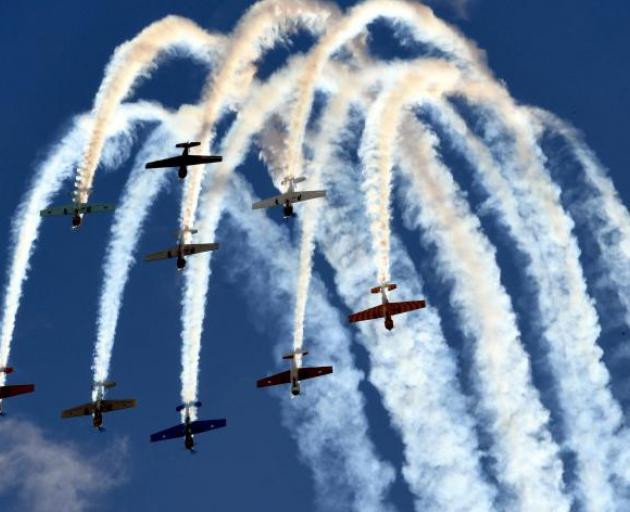 The Yak 52 team performs some aerial acrobatics at Warbirds over Wanaka  last weekend. Photo:...