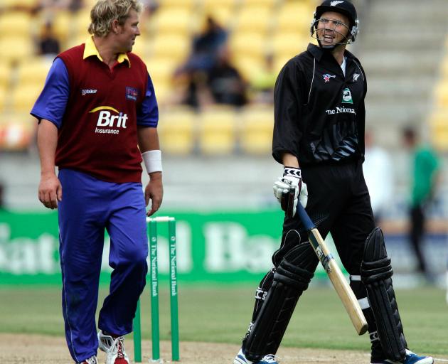Jeff Wilson shares a joke with World XI captain Shane Warne during the one-dayer in Wellington in...