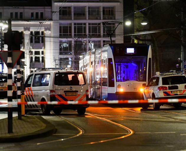 Police vehicles are seen near an Apple store in central Amsterdam during a hostage incident in the store, in Amsterdam. Photo: Reuters
