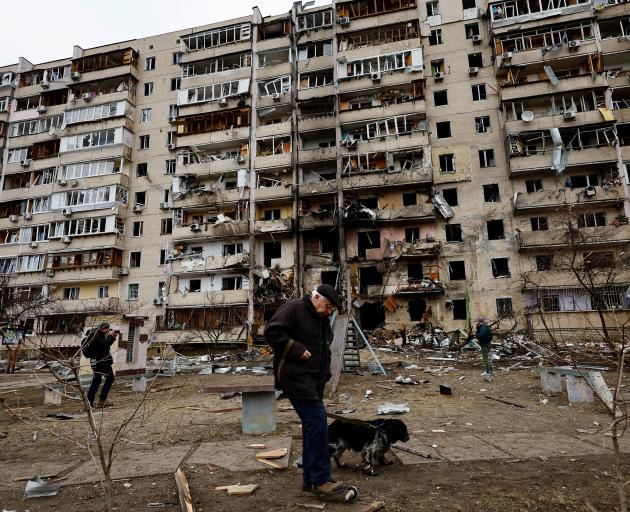 A residential building is damaged, after Russia launched a massive military operation against Ukraine, in Kyiv. Photo: Reuters