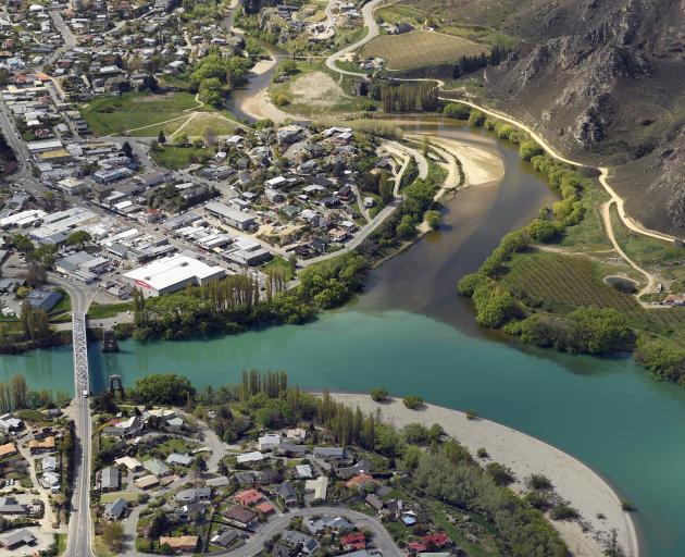The darker Manuherikia River meets the Clutha below the town centre at Alexandra. PHOTO: STEPHEN...