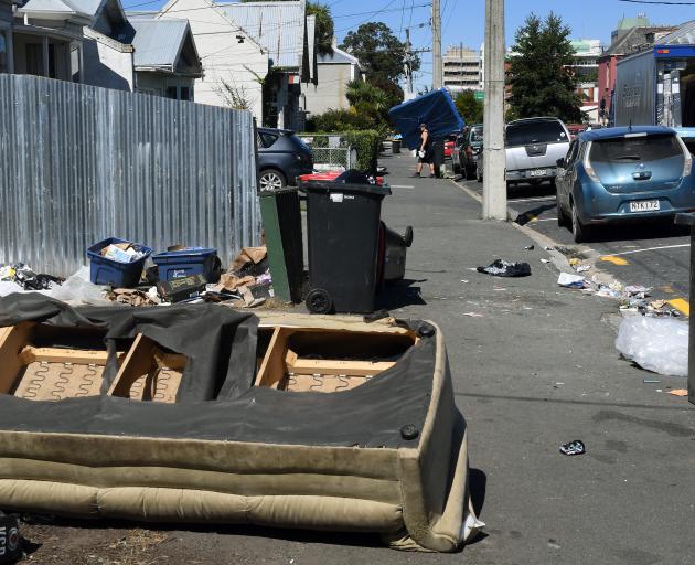 A mattress is delivered in Castle St near post-party debris after partygoers were notified they...