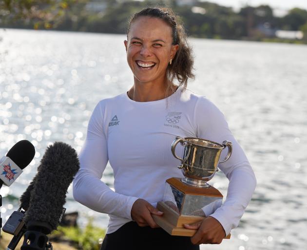 Dame Lisa Carrington holds the Lonsdale Cup in Auckland in January. The cup is presented annually...