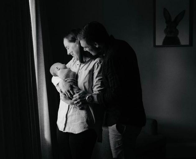 Tom Latham, Nicole and their baby son Angus. Photo: Supplied