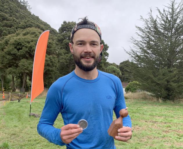 Sam Harvey celebrates after winning the Pigs Backyard Ultra near Dunedin at the weekend. PHOTO:...