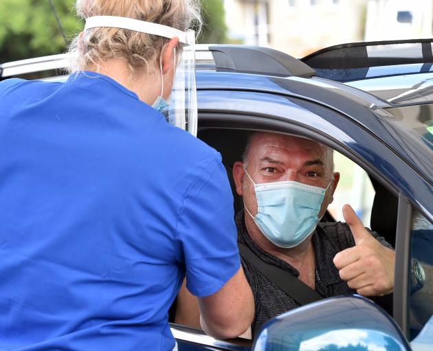 Dunedin man Peter Enitermark give the thumbs up as he gets his booster shot at Te Kaika’s drive...