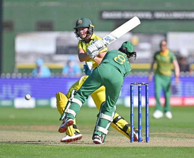 Australia’s captain Meg Lanning pushes the ball out of the reach of South Africa’s wicketkeeper...