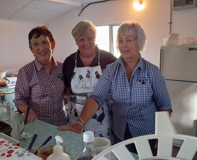 Sue Bell, Diane Smith and Prue Lamont keep the home fires burning, the tea brewing and the food...