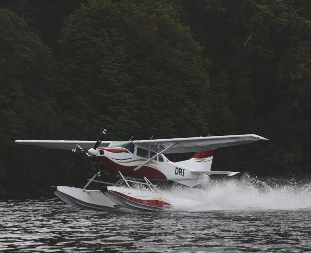 Wings and Water’s Cessna 206 lands on Lake Manapouri.