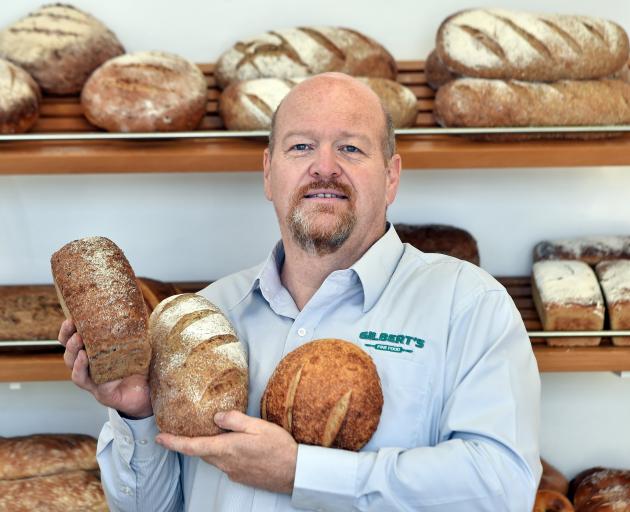 Gilbert’s Fine Food owner Kevin Gilbert holds freshly baked bread which is fast becoming a...