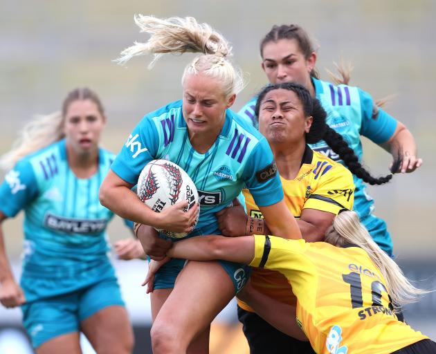 Grace Steinmetz tries to break the Hurricanes Poua defence in Hamilton last night. Photo: Getty...