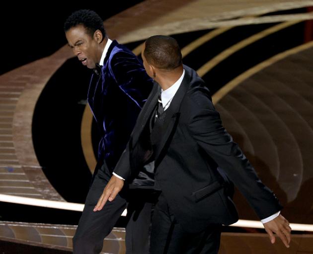 US actor Will Smith slaps US actor Chris Rock onstage during the 94th Oscars at the Dolby Theatre...
