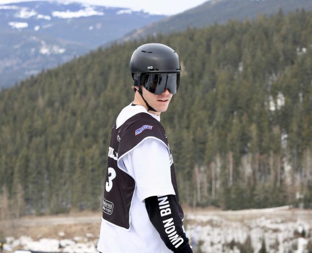 Tiarn Collins waits for his run at the Czech Republic round of the snowboard slopestyle World Cup...