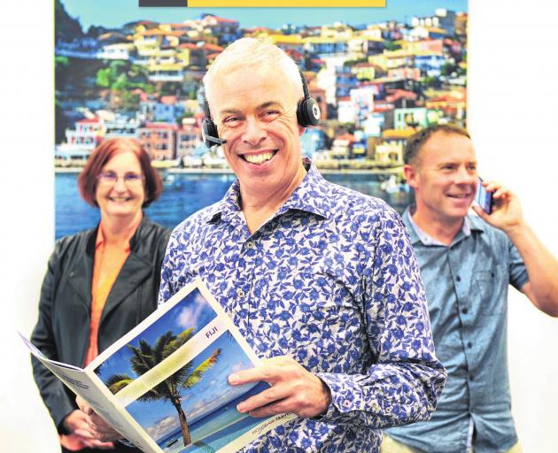 Business is booming for travel specialists (from left) Rachel Carr, Gary Harley and Paul Reid, at...
