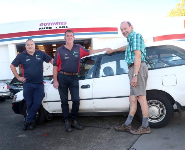 Guthrie's Auto Cares Paul Rod (left) and John Sherman with Graeme Hebley's 1994 Toyota Corolla....