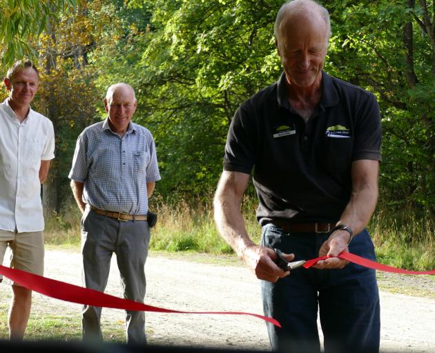 QEII National Trust chairman Bruce Wills cuts the ribbon to officially open the new 50km Coronet...