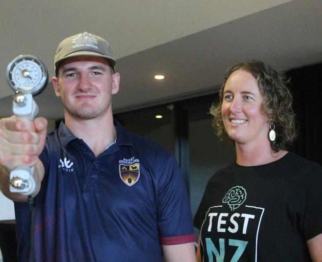 Headache Clinic founder Helen Tufui (right) helps Southland Stags player Rory van Vugt with his...