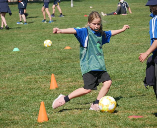 Carisbrook School pupil Chloe Farrar (10) defends the goal.