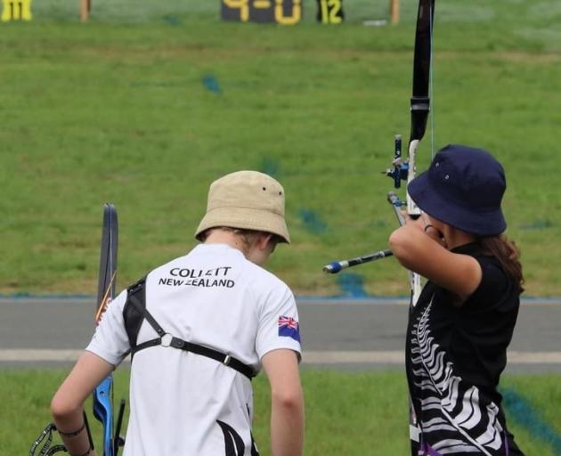 Mount Aspiring College pupil Zoe Antone (right) is passionate about archery.