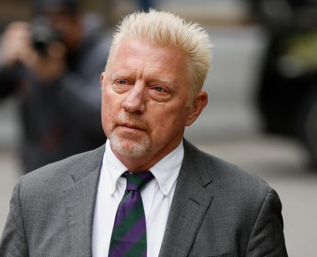 Boris Becker wore a tie in the purple and green colours of the Wimbledon tournament as he...