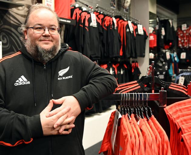 The Champions of the World Dunedin store manager Matthew Clifford stands in the George St store...