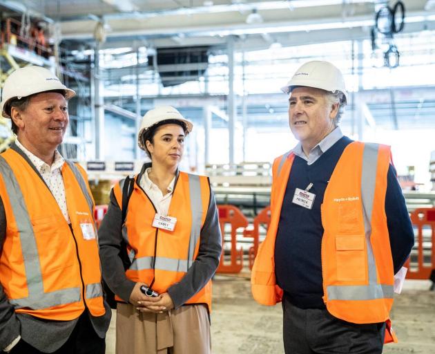 Kim Barrett of Haydn & Rollett with Costco's Casey Lang and Patrick Noone inside today. Photo / Michael Craig