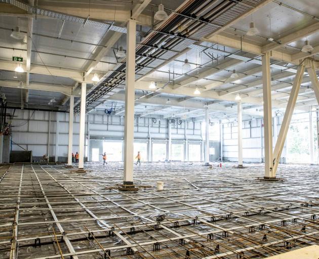 The post-tension concrete and steel floor inside part of the giant warehouse. Photo / Michael Craig The post-tension concrete and steel floor inside part of the giant warehouse. Photo / Michael Craig