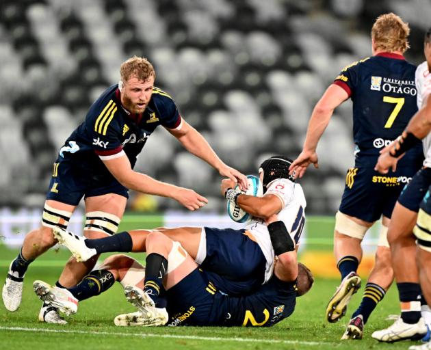Christian Leali'ifano of Moana Pasifika is tackled by the Highlanders defence. Photo: Getty Images