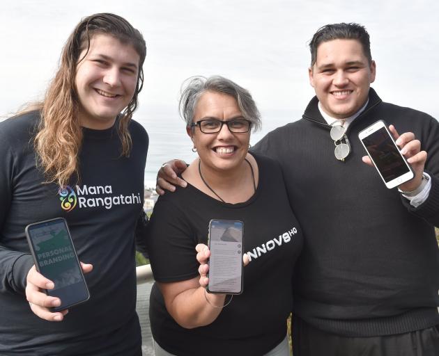 Blake Armstrong (left), Heidi Renata and Mitch Porter-Thomas display the new Mana Rangatahi app...