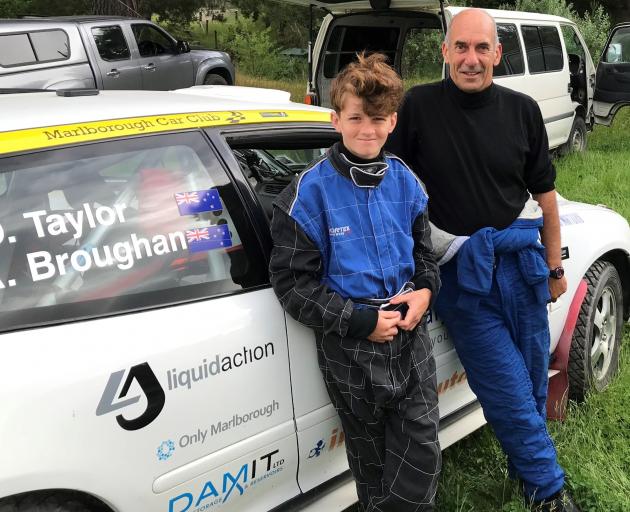 Grandson-grandfather duo Arthur Broughan (13) and David Taylor (67) take a break from Otago Rally...