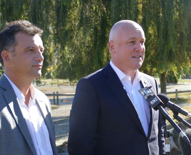 National Party leader Christopher Luxon (right) in Queenstown on Thursday with Southland MP...