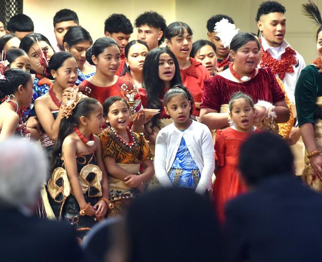 Young people from the Tongan community sing a welcome to the prime minister.