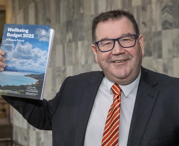 Finance Minister Grant Robertson with a copy of his Wellbeing Budget 2022 at Parliament,...