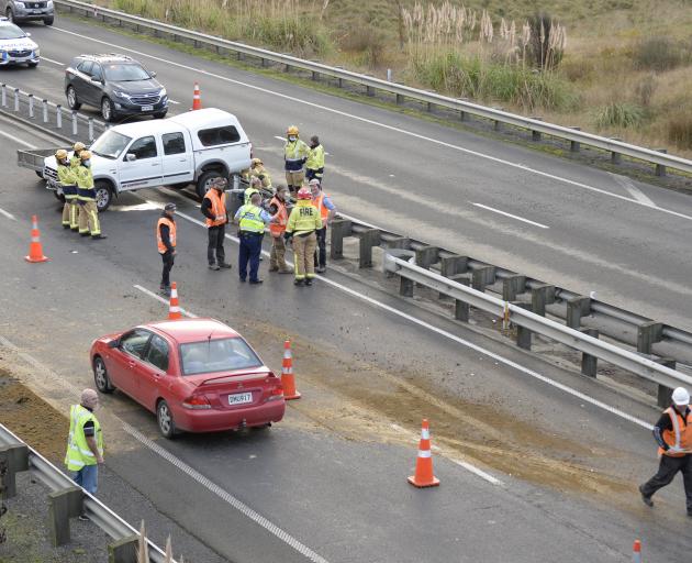 Contractors and emergency services at the crash scene yesterday. PHOTO: GERARD O’BRIEN